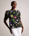 PHOEBIA-Tops-Make a statement with this beautiful and feminine boxy top. PHOEBIA's scattered bouquet floral print, short puff sleeves, and oversized self-tie back create an eye-catching silhouette. Crafted from textured fabric with a crew neck, it's perfect for a day out or a special occasion.The fabric of this product is made with 100% recycled polyester. Using recycled polyester helps divert plastic waste from ending in landfills, and helps us to reduce our dependence on virgin materials. Boxy top Scatter